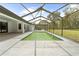 Spacious screened-in pool and extended patio provide the ultimate outdoor relaxation and entertainment at 206 Forest Wood Ct, Spring Hill, FL 34609