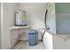 Utility room features water heater, water softener, and HVAC system for home comfort and efficiency at 206 Forest Wood Ct, Spring Hill, FL 34609