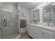 Modern bathroom featuring a double vanity, marble shower, and stylish fixtures at 2271 Carolyn Dr, Dunedin, FL 34698