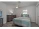 Serene bedroom with a comfortable bed, stylish dresser, and soft, neutral tones at 2271 Carolyn Dr, Dunedin, FL 34698