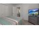 Bright bedroom with modern furniture, closet space, and view to living area at 2271 Carolyn Dr, Dunedin, FL 34698