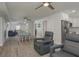 Open-concept living space with modern furniture, ceiling fans, and abundant natural light at 2271 Carolyn Dr, Dunedin, FL 34698