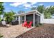 Backyard with patio, seating, grill, privacy fence, and landscaping at 2334 Tropical Shores Se Dr, St Petersburg, FL 33705