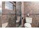 Bathroom featuring earth-tone tiles in the shower and on the walls at 2334 Tropical Shores Se Dr, St Petersburg, FL 33705