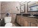 Bathroom featuring double sinks, granite countertops, and a tile backsplash at 2334 Tropical Shores Se Dr, St Petersburg, FL 33705