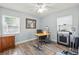 This bedroom features wood floors, a ceiling fan, and lots of light at 2334 Tropical Shores Se Dr, St Petersburg, FL 33705