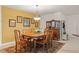 Dining room featuring a wooden table with seating for six under a pendant light fixture at 2334 Tropical Shores Se Dr, St Petersburg, FL 33705