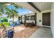 Comfortable front porch, with shade, chairs and table, great for relaxing and enjoying the view at 2334 Tropical Shores Se Dr, St Petersburg, FL 33705