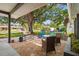 Comfortable front porch, with shade, chairs and table, great for relaxing and enjoying the view at 2334 Tropical Shores Se Dr, St Petersburg, FL 33705