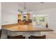 Kitchen featuring granite countertops, an island with barstool seating, and stainless steel appliances at 2334 Tropical Shores Se Dr, St Petersburg, FL 33705