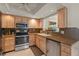 Kitchen includes stainless steel appliances, cabinets, and sink at 2334 Tropical Shores Se Dr, St Petersburg, FL 33705