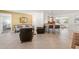 Open living room with tile flooring with a view into the dining and living area at 2334 Tropical Shores Se Dr, St Petersburg, FL 33705