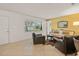 Open living room with tile flooring with a view into the dining and living area at 2334 Tropical Shores Se Dr, St Petersburg, FL 33705