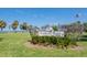 View of the Lassing Park signage amidst lush greenery and palm trees overlooking the water at 2334 Tropical Shores Se Dr, St Petersburg, FL 33705