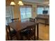 Comfortable dining area features a wooden table with seating and a window with natural light at 240 N Bayshore Blvd # 102, Clearwater, FL 33759