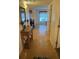Inviting foyer with a console table and view of the dining area, showing an open floor plan at 240 N Bayshore Blvd # 102, Clearwater, FL 33759
