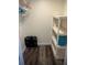 Walk-in closet with vinyl shelving and wood-look floors at 240 N Bayshore Blvd # 102, Clearwater, FL 33759