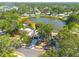 Beautiful single-story home with mature trees and a well-maintained lawn in a lakeside community at 2436 Beacon Groves Blvd, Palm Harbor, FL 34683
