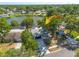 Beautiful single-story home with mature trees and a well-maintained lawn in a lakeside community at 2436 Beacon Groves Blvd, Palm Harbor, FL 34683