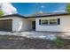 Charming single-story home with brick accents, updated windows, and a paved entryway at 2436 Beacon Groves Blvd, Palm Harbor, FL 34683