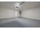 Empty garage features a white brick wall and door to the home at 2436 Beacon Groves Blvd, Palm Harbor, FL 34683