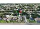 Aerial view of a residential neighborhood with mature trees and well-maintained lawns at 2803 Abbey Grove Dr, Valrico, FL 33594