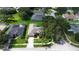 Beautiful single-Gathering home with lush green lawn, mature trees and a long driveway at 2803 Abbey Grove Dr, Valrico, FL 33594