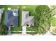 Aerial view of a home with a well-maintained backyard and an enclosed swimming pool next door at 2803 Abbey Grove Dr, Valrico, FL 33594