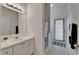 A bright bathroom featuring vanity with sink and walk-in glass shower enclosure at 2803 Abbey Grove Dr, Valrico, FL 33594