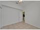 A simple bedroom with tile flooring, neutral walls, and a ceiling fan at 2803 Abbey Grove Dr, Valrico, FL 33594