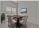 Dining room features neutral walls, pendant lighting, and a wall-mounted television for entertaining at 2803 Abbey Grove Dr, Valrico, FL 33594