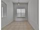 Bright dining room with neutral walls and a large window offering plenty of natural light at 2803 Abbey Grove Dr, Valrico, FL 33594
