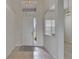 Bright and airy foyer with tile flooring and a clear view to the outside at 2803 Abbey Grove Dr, Valrico, FL 33594
