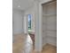 Hallway with tile flooring, built-in desk and storage, and access to an outdoor area at 2803 Abbey Grove Dr, Valrico, FL 33594