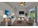 Comfortable living room featuring neutral walls, natural light, and modern furnishings at 2803 Abbey Grove Dr, Valrico, FL 33594