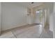 Spacious and bright living room with tiled floors, archways, and a view of the front door at 2803 Abbey Grove Dr, Valrico, FL 33594