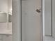 A glass-enclosed walk-in shower with white tiling and a rain shower head at 2803 Abbey Grove Dr, Valrico, FL 33594