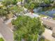Aerial view of home with mature trees and landscaping in a waterfront community at 320 Tallahassee Ne Dr, St Petersburg, FL 33702