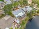 Aerial view of waterfront home with mature trees and landscaping at 320 Tallahassee Ne Dr, St Petersburg, FL 33702
