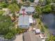 Aerial view of waterfront home with mature trees and landscaping at 320 Tallahassee Ne Dr, St Petersburg, FL 33702