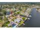 Aerial view of waterfront home with mature trees, dock, and beautiful landscaping at 320 Tallahassee Ne Dr, St Petersburg, FL 33702