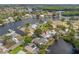 Aerial view of waterfront home with mature trees, dock, and beautiful landscaping at 320 Tallahassee Ne Dr, St Petersburg, FL 33702
