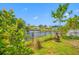 This property features a backyard with a waterfront view and lush foliage at 320 Tallahassee Ne Dr, St Petersburg, FL 33702