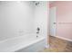 Clean bathroom featuring white tile in the shower and a bathtub with chrome fixtures at 320 Tallahassee Ne Dr, St Petersburg, FL 33702