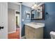 Bathroom with a vanity sink and a framed mirror at 320 Tallahassee Ne Dr, St Petersburg, FL 33702