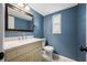 Well-lit bathroom with vanity sink, and a framed mirror at 320 Tallahassee Ne Dr, St Petersburg, FL 33702