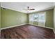 Large bedroom featuring hardwood floors, a ceiling fan, and lots of natural light at 320 Tallahassee Ne Dr, St Petersburg, FL 33702