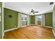 Spacious bedroom featuring wood floors, with a ceiling fan at 320 Tallahassee Ne Dr, St Petersburg, FL 33702