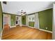 Bedroom featuring wood floors, a ceiling fan, and natural light at 320 Tallahassee Ne Dr, St Petersburg, FL 33702