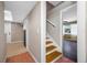 Hallway with tile flooring and a staircase leading to an upstairs bedroom at 320 Tallahassee Ne Dr, St Petersburg, FL 33702